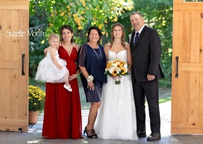 Beautiful outdoor wedding with family and bride at Lupines & Lace.