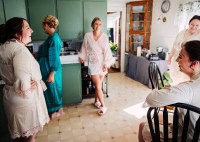 Elegant wedding morning at Lupines & Lace with bridesmaids and family in a cozy, charming setting.